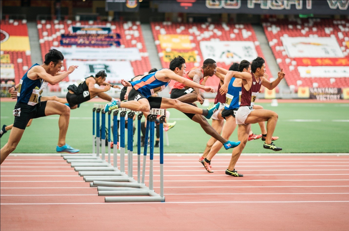 A group of men running on a track