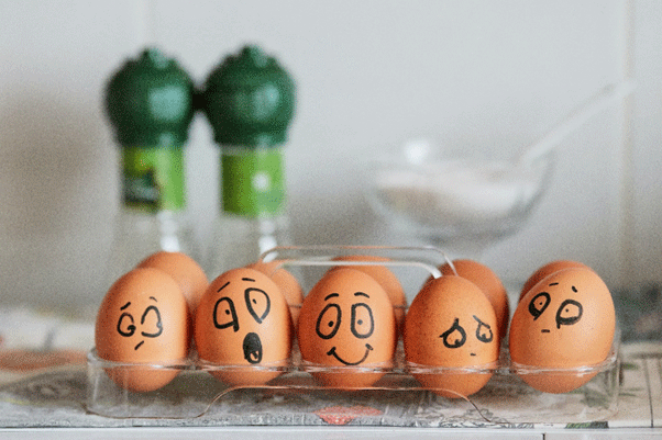 A group of eggs with faces drawn on them